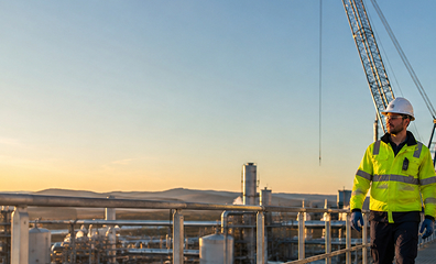industrial-factory-worker-standing-high-metal-construction-production-plant 1